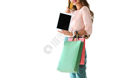 在网上用平板电脑和信用卡购买物袋图片
