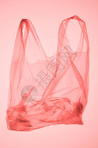 内装瓶子的塑料袋在粉色面图片