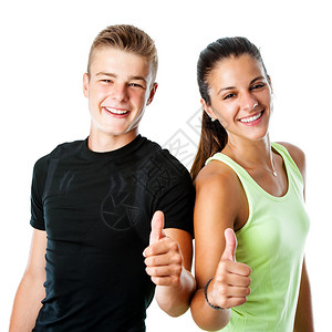 运动服中活跃的未成年夫妇在白色背景上独立大拇图片