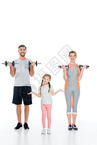 有运动的父母和女儿有哑铃图片