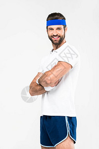快乐的体育运动员在复古运动中穿着横穿双臂图片