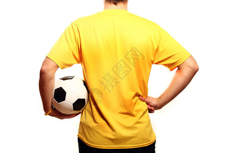 一张年轻足球员身穿黄色T恤的图片穿着白色图片