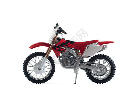 白色背景中突显的红色摩托车玩具图片