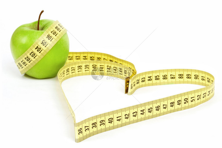 测量心形和绿苹果的磁带测量健图片