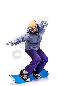 妇女穿着雪板滑动在白边图片
