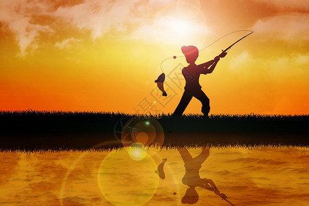 一个男孩在日落时钓鱼的图片