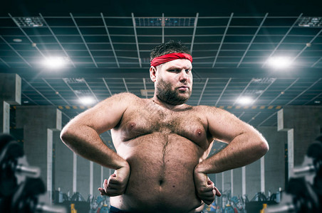 健身俱乐部运动的肥胖运动员胖超重问题图片