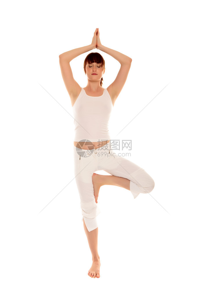 做瑜伽锻炼的年轻美女孤立图片