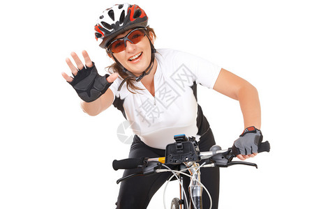 年轻的女骑自行车的年轻女子在白色图片