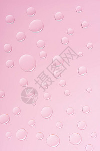 含有粉红色透明水滴的抽象背景图片