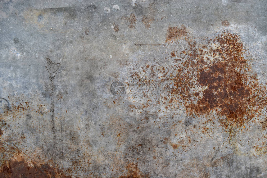 水泥墙壁纹理上的钢漆生锈红图片