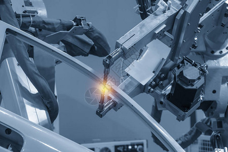 具有照明效应的焊接机器人机焊接汽车零部件现代制造工艺业40概念单位背景图片