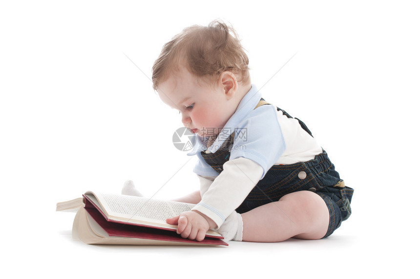 一岁的可爱男孩读一本书在白色沃尔特斯科特艾芬豪一书中的文字图片