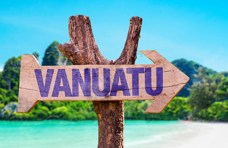 瓦努阿图木牌与海滩背景图片