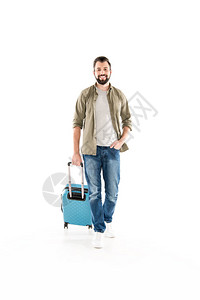 快乐的英俊男人准备了旅行的李箱图片