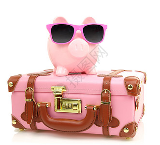 粉红手提箱和小猪银行图片