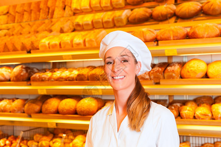面包店销售新鲜面包糕点和面包制品的女面图片