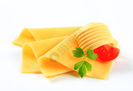 薄的黄色奶酪和黄油卷曲图片