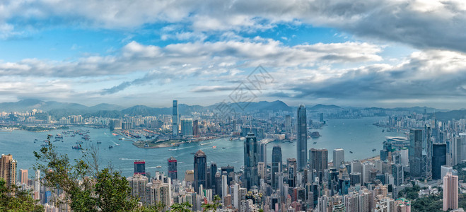 从山顶的香港全景城市景观在日出图片
