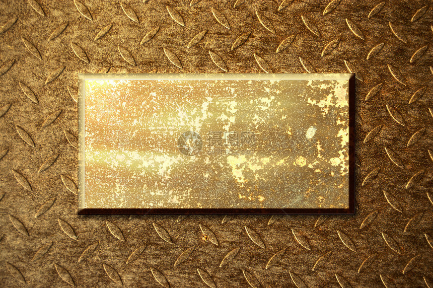 金属表面背景上的金色属板图片