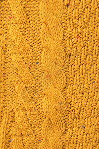 质感温暖的针织黄色带图案毛衣背景图片