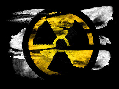 威慑用水彩画在黑色纹理纸上的核辐射符号插画