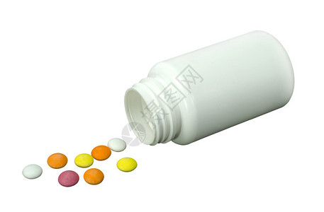 一些不同颜色的药丸白色罐子和白色背图片