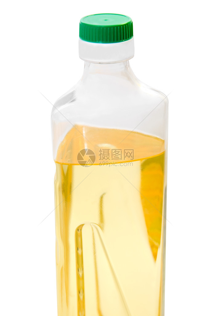 一瓶被白色隔离的葵花籽油图片