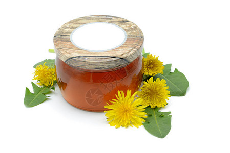 自制的丹德利翁蜂蜜配有蜂蜜玻璃和花头花朵图片
