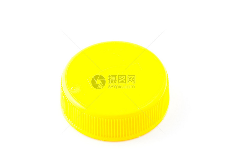 孤立的黄色塑料瓶盖图片
