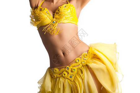 身穿黄色明亮服装的女舞腹部舞者身上的托索图片