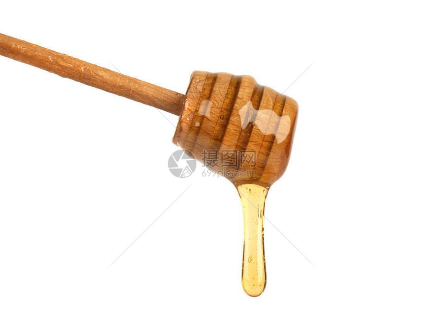 新鲜蜂蜜从白色背景中分离的蜂蜜勺滴下图片