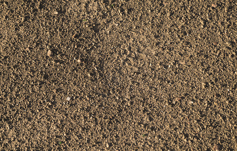 棕色地球和砾石宏观纹理背景图片