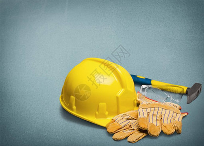 黄色安全帽和手套建筑理念图片