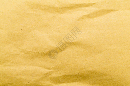 黄色皱巴的纸纹理背景背景图片