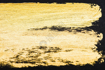 黑色背景上的黄水彩色笔背景图片