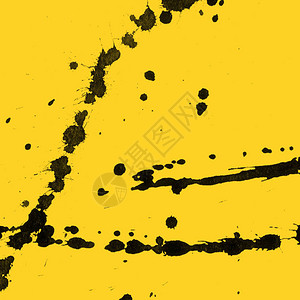 抽象黑色涂料在黄色背景图片