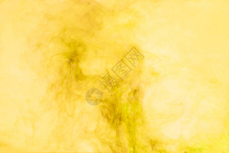 黄色油漆飞溅的特写视图图片
