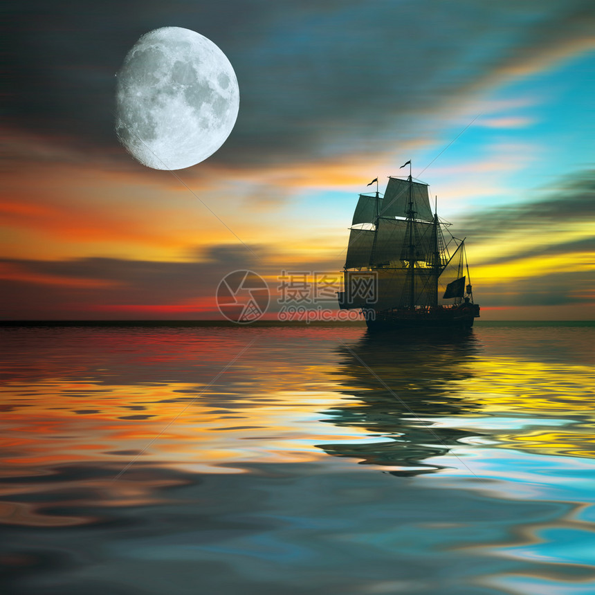 帆船对美丽的日落景观图片