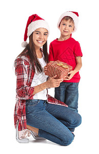 带着圣诞礼物的白本女人和小儿子图片