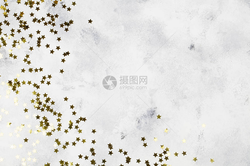 散落金色星星装饰碎片的背景图片