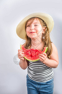 快乐的小孩用西瓜图片