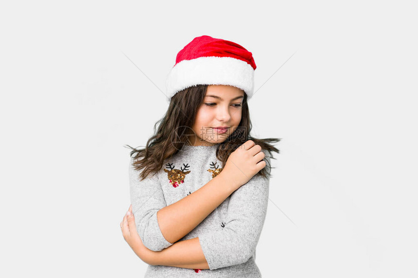 庆祝圣诞节的小女孩拥抱微笑无图片