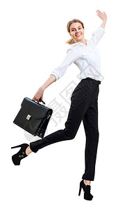 带着公文包穿正式衣服跳跃的年轻女商人快乐图片