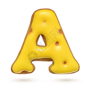 大写字母黄色自制姜饼干孤立背景图片