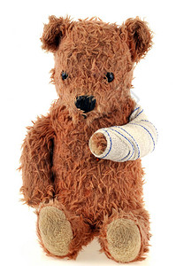 泰迪熊带绷的手臂紧贴图片