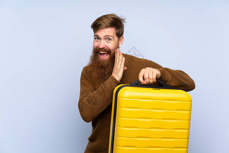 有长胡子的红头人拿着一个手提箱图片