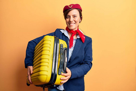 身穿空姐制服的年轻美女手拿机舱包图片