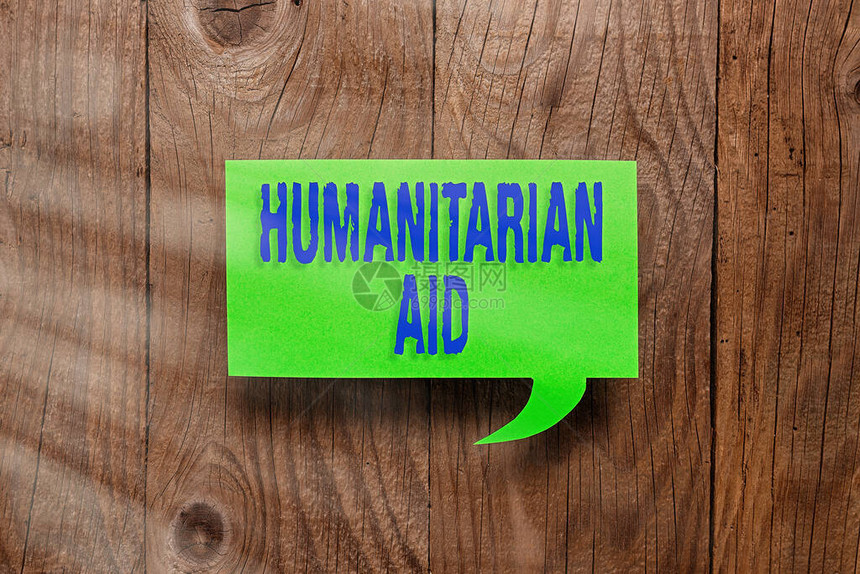 显示人道主义援助的概念手写概念意味着自然和人为灾难后提供的即时援助不同背景下带有智能图片