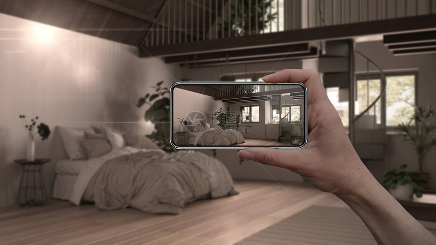 手持智能手机AR应用模拟真实家居中的家具和室内设计产品建筑师设计师概念模糊背景带双人图片